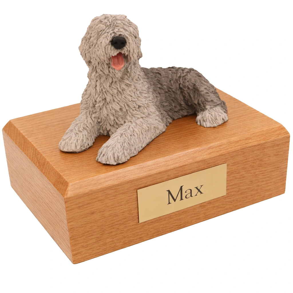 Memorial cremation urn with laying Sheepdog dog figurine, oak finish