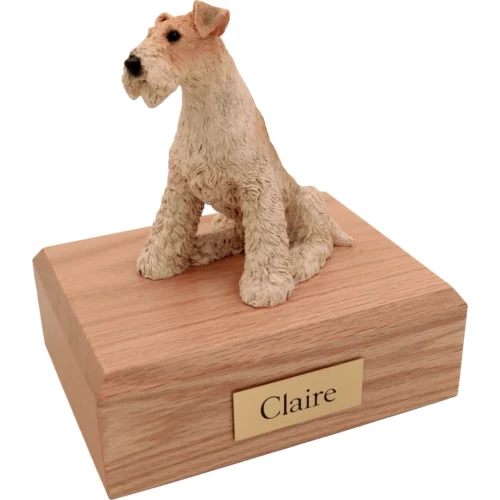 Memorial cremation urn with sitting Fox Terrier dog figurine, oak finish