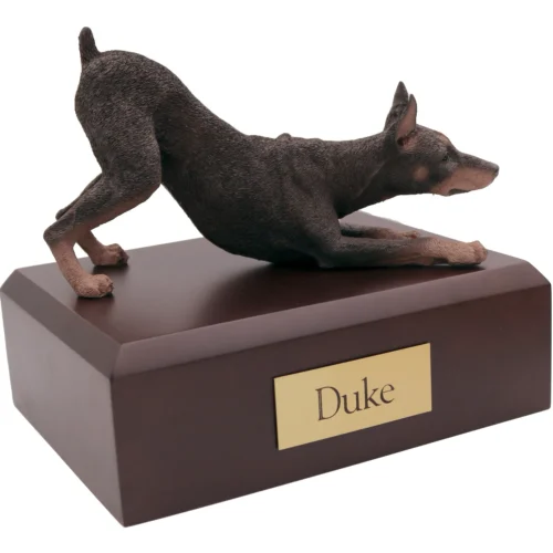 Memorial cremation urn with red ears up Doberman Pinscher dog figurine, walnut finish