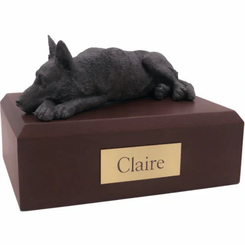 Memorial cremation urn with laying black German Shepherd dog figurine, walnut finish