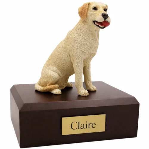 Memorial cremation urn with yellow Labrador Retriever with ball dog figurine, walnut finish
