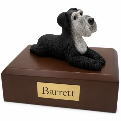 Memorial cremation urn with laying ears down black & silver Schnauzer dog figurine, walnut finish