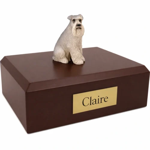 Memorial cremation urn with sitting ears down gray Schnauzer dog figurine, walnut finish