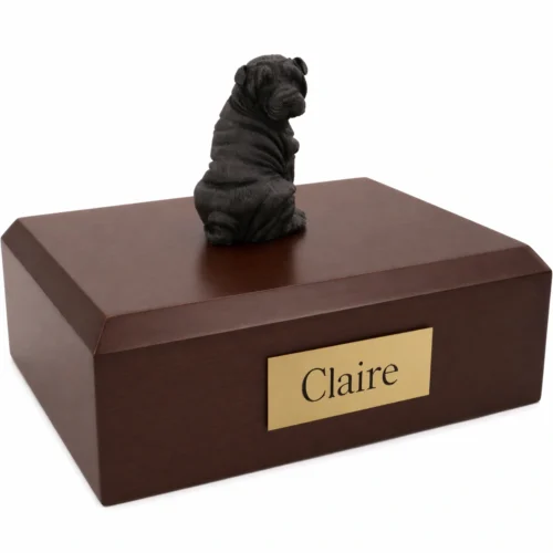 Memorial cremation urn with sitting black Pug dog figurine, walnut finish