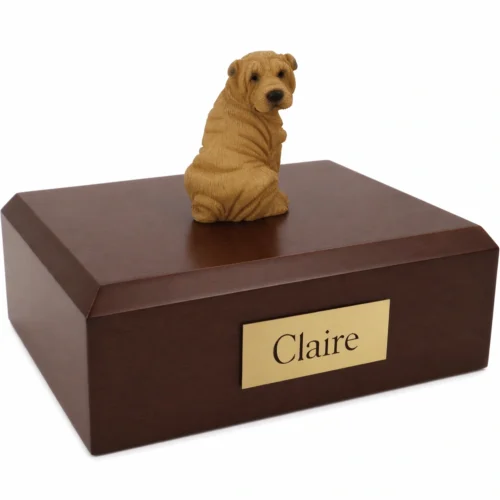 Memorial cremation urn with sitting tan Pug dog figurine, walnut finish