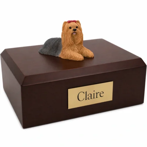 Memorial cremation urn with laying Yorkshire Terrier (Yorkie) dog figurine, walnut finish