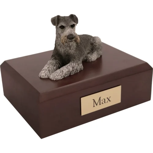 Memorial cremation urn with laying ears down Schnauzer dog figurine, walnut finish