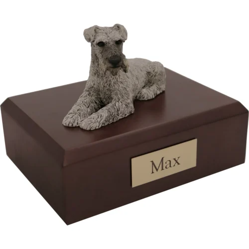 Memorial cremation urn with laying ears down silver Schnauzer dog figurine, walnut finish
