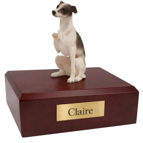 Memorial cremation urn with sitting black and white Whippet dog figurine, maple finish