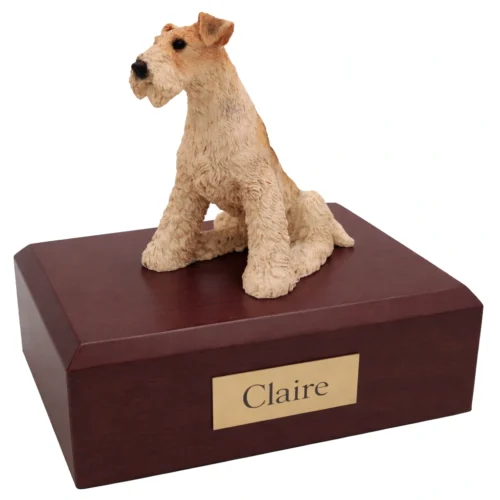 Memorial cremation urn with sitting Fox Terrier dog figurine, walnut finish