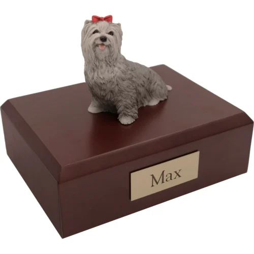 Memorial cremation urn with sitting gray Yorkshire Terrer (Yorkie) dog figurine, walnut finish