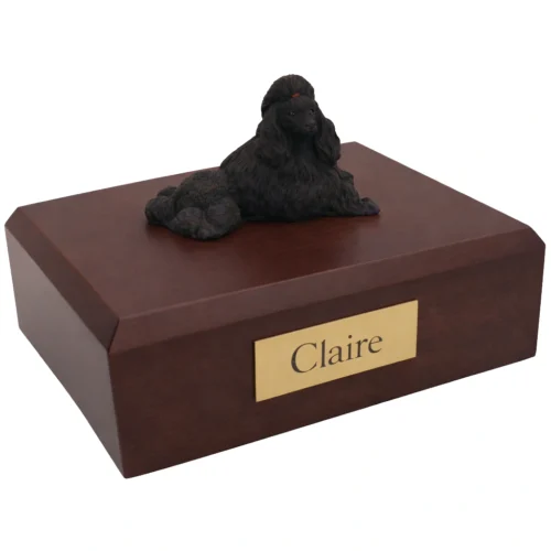 Memorial cremation urn with laying black Poodle dog figurine, walnut finish
