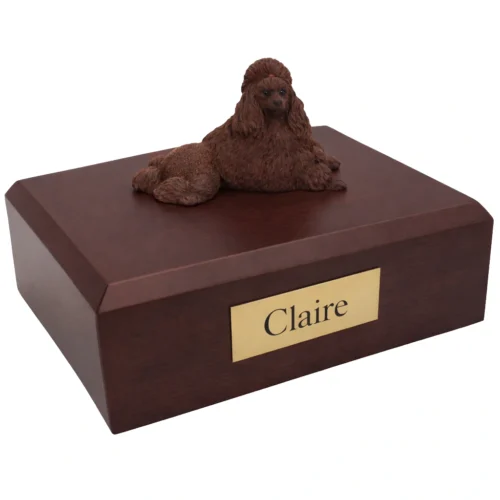 Memorial cremation urn with laying chocolate Poodle dog figurine, walnut finish