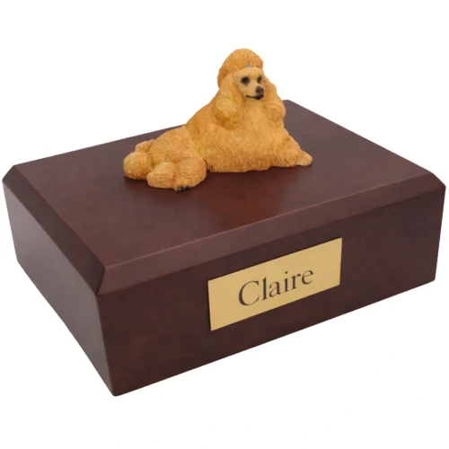 Memorial cremation urn with laying apricot Poodle dog figurine, walnut finish