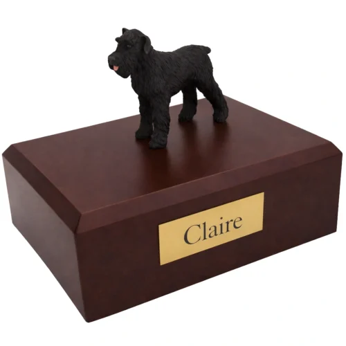 Memorial cremation urn with standing black Schnauzer dog figurine, walnut finish