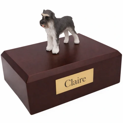 Memorial cremation urn with standing gray and white Schnauzer dog figurine, walnut finish