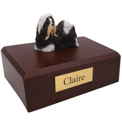 Memorial cremation urn with standing black and white Shih Tzu dog figurine, walnut finish