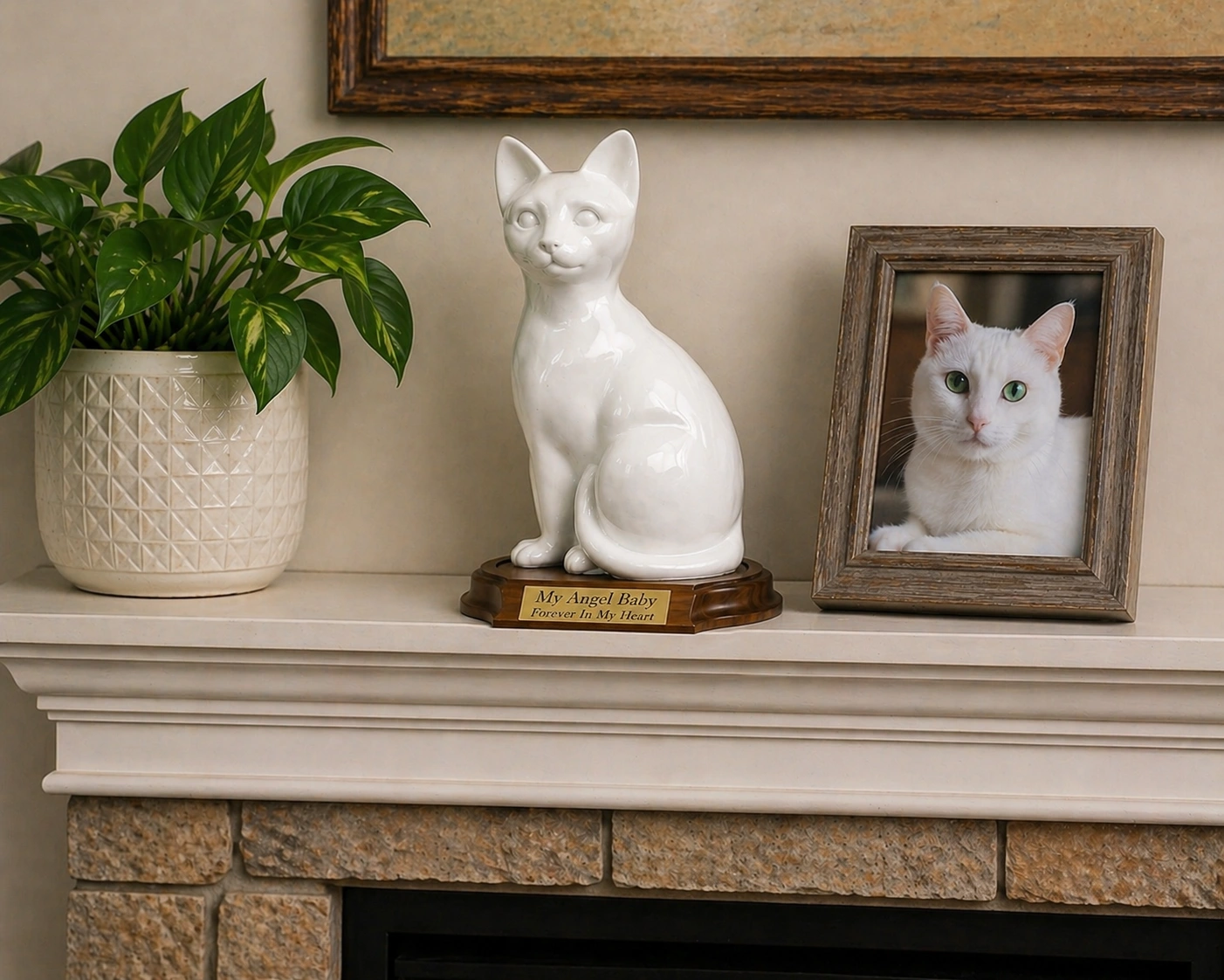Faithful Feline cast resin and stone cat memorial cremation urn, white, sitting, with wood base and engraved metal plate, on mantle