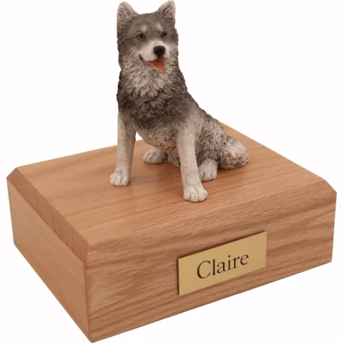 Memorial cremation urn with sitting gray Husky dog figurine, oak finish