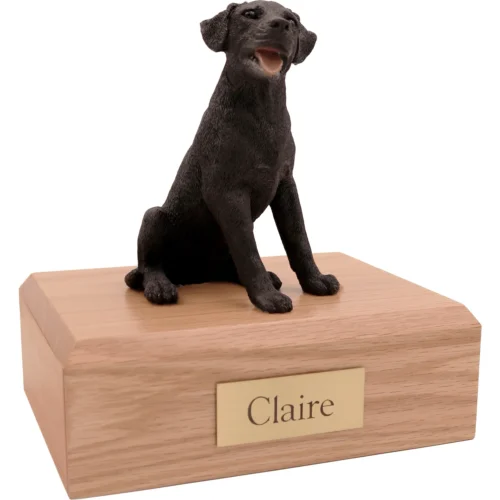 Memorial cremation urn with sitting black Labrador Retriever dog figurine, oak finish
