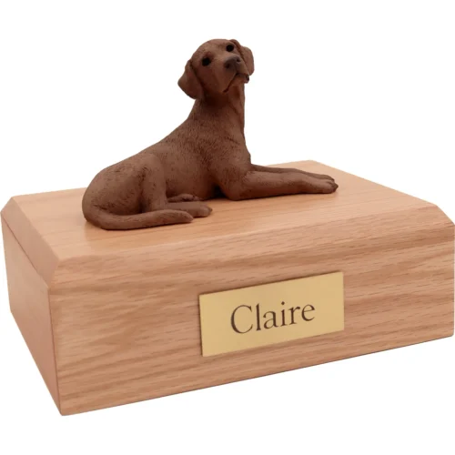 Memorial cremation urn with laying chocolate Labrador Retriever dog figurine, oak finish