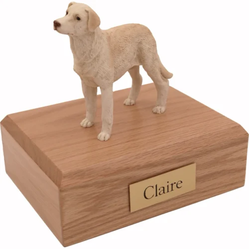Memorial cremation urn with standing yellow Labrador Retriever dog figurine, oak finish