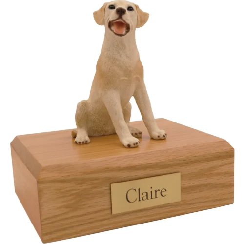Memorial cremation urn with sitting yellow Labrador Retriever dog figurine, oak finish