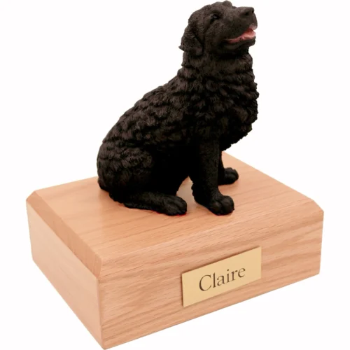 Memorial cremation urn with sitting black Newfoundland dog figurine, oak finish