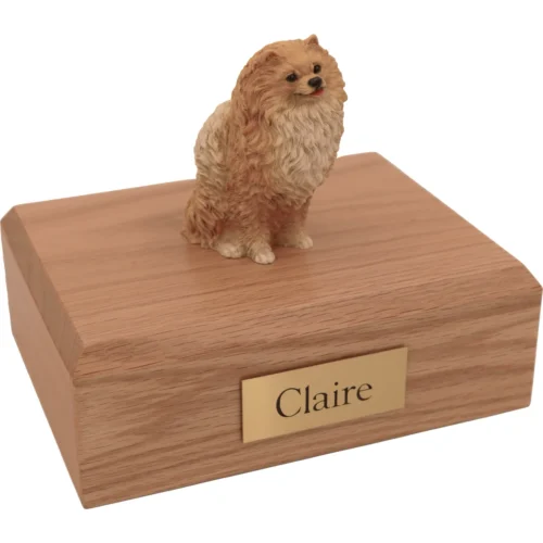 Memorial cremation urn with sitting brown red Pomeranian dog figurine, oak finish