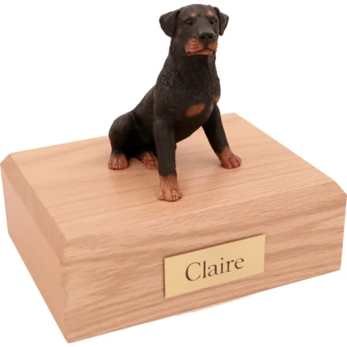 Memorial cremation urn with sitting Rottweiler dog figurine, oak finish
