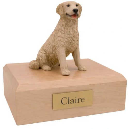 Memorial cremation urn with sitting blonde Golden Retriever dog figurine, maple finish