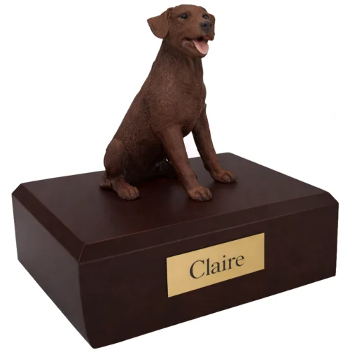 Memorial cremation urn with sitting chocolate Labrador Retriever dog figurine, walnut finish