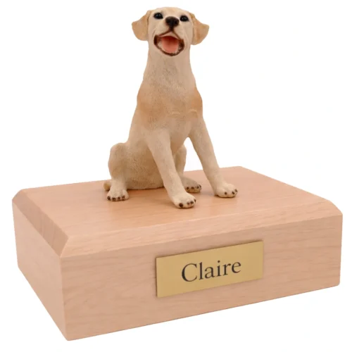 Memorial cremation urn with sitting yellow Labrador Retriever dog figurine, maple finish