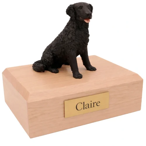Memorial cremation urn with sitting black Labrador Retriever dog figurine, maple finish