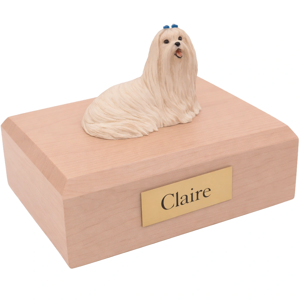 Memorial cremation urn with laying Maltese dog figurine, maple finish