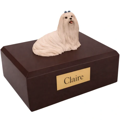 Memorial cremation urn with laying Maltese dog figurine, walnut finish