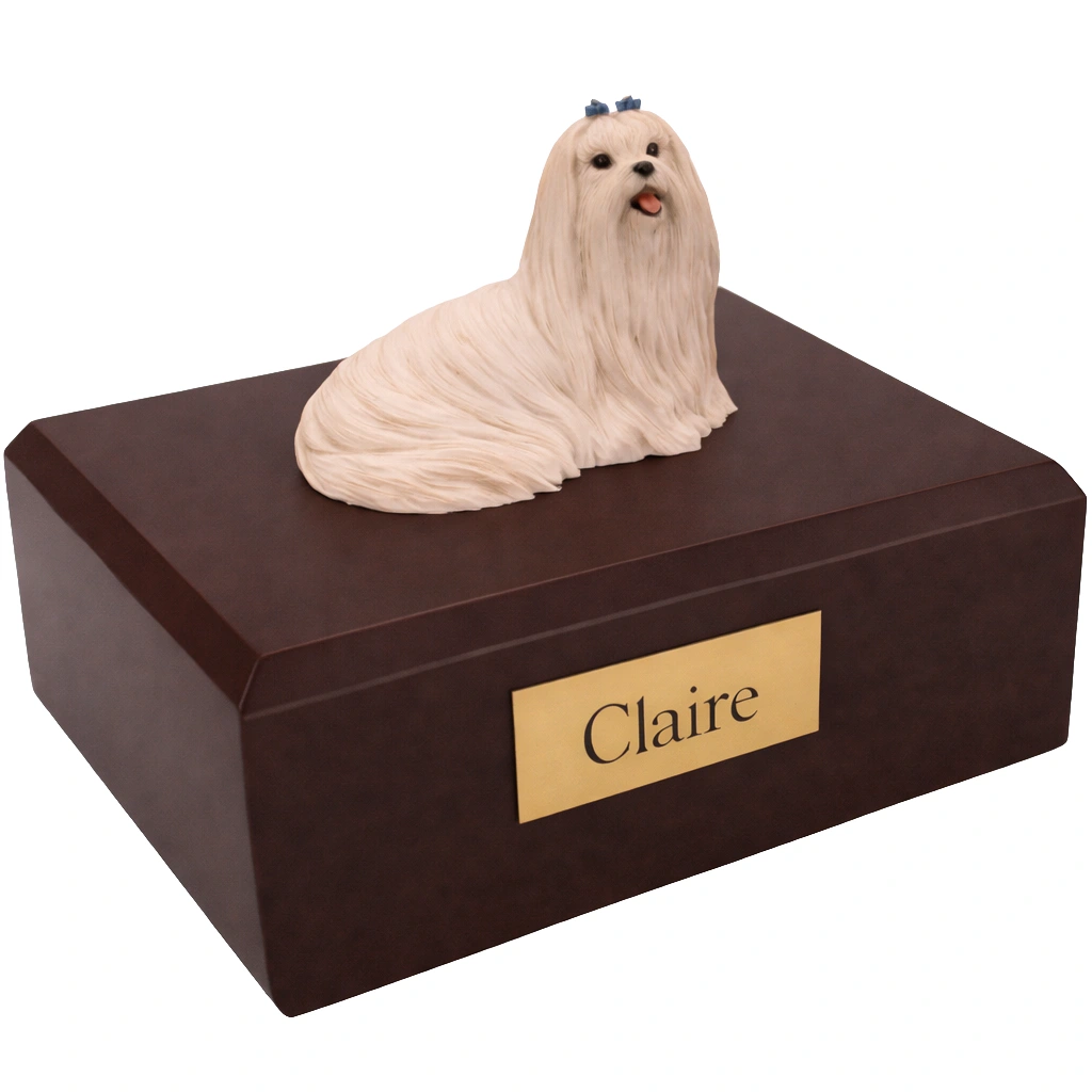 Memorial cremation urn with laying Maltese dog figurine, walnut finish