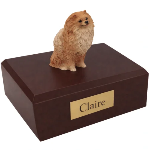 Memorial cremation urn with sitting brown Pomeranian dog figurine, walnut finish