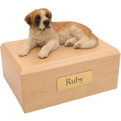 Memorial cremation urn with laying Saint Bernard dog figurine, maple finish