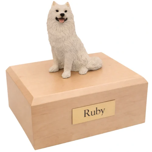 Memorial cremation urn with sitting white Samoyed dog figurine, maple finish