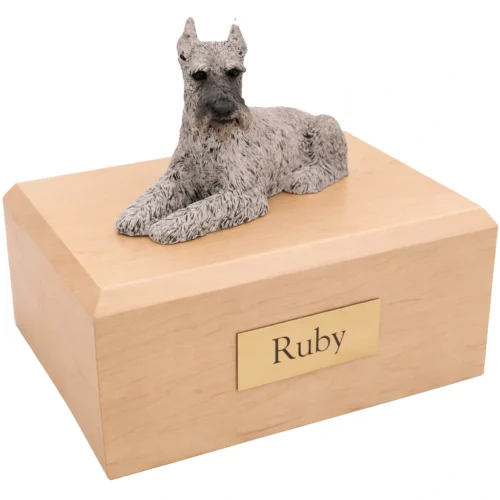Memorial cremation urn with laying silver ears up Schnauzer dog figurine, maple finish