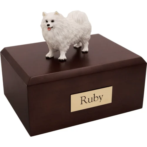 Memorial cremation urn with standing Samoyed dog figurine, walnut finish