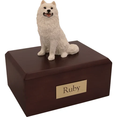 Memorial cremation urn with sitting white Samoyed dog figurine, walnut finish