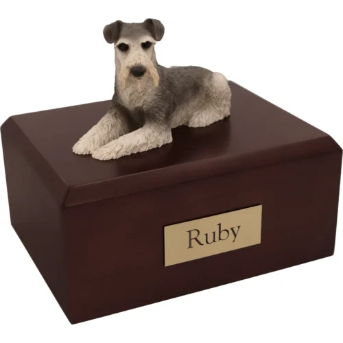 Memorial cremation urn with laying ears down silver gray schnauzer dog figurine, walnut finish