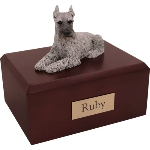 Memorial cremation urn with laying ears up silver Schnauzer dog figurine, walnut finish