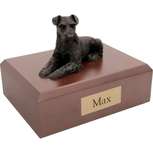 Memorial cremation urn with laying ears down black Schnauzer dog figurine, walnut finish