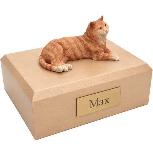Memorial cremation urn with laying orange Tabby cat figurine, maple finish