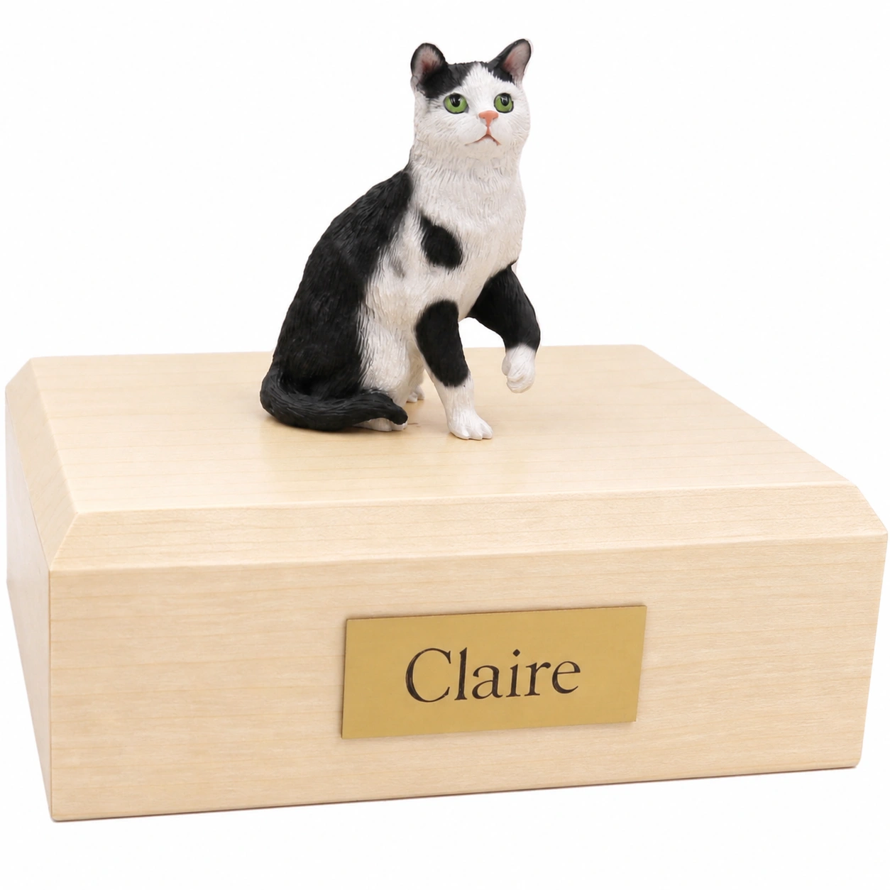Memorial cremation urn with sitting black and white tuxedo cat figurine, maple finish