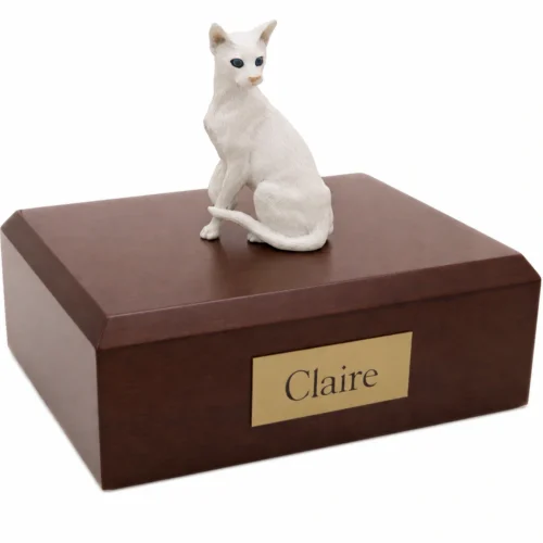 Memorial cremation urn with sitting white Oriental shorthaired cat figurine, walnut finish