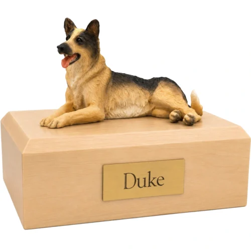 Memorial cremation urn with laying German Shepherd dog figurine, maple finish